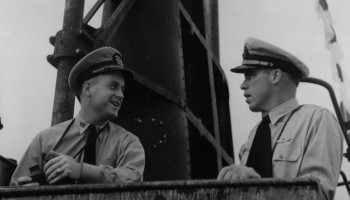 O’Kane speaks with his commanding officer, Dudley Morton, on the bridge of the Wahoo c. February 1943